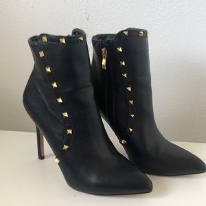 Black high heel boots with gold studs